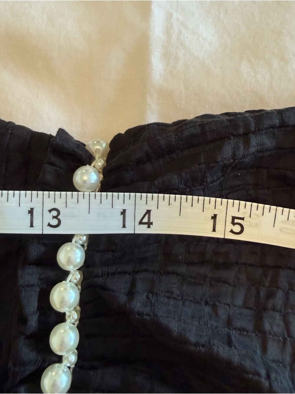 Feminine flowy top from Entro.  Black Ruffle Sleeve Blouse with Pearl Trim - Picture 10 of 14